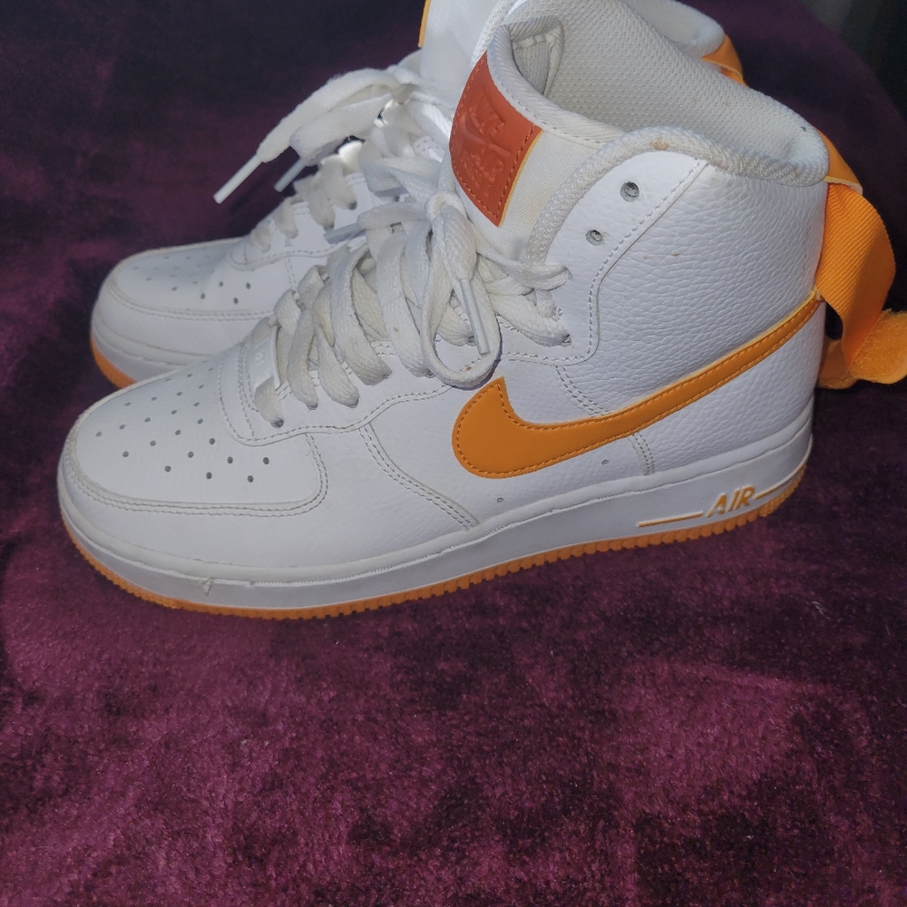 Orange and white Nike air force ones.